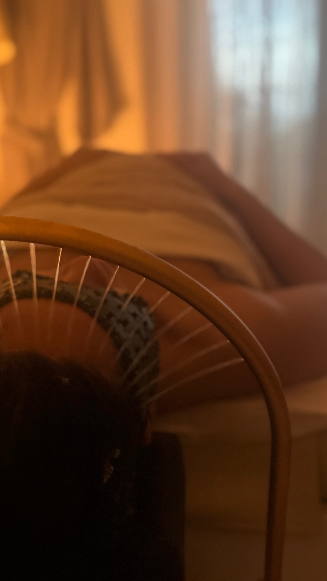 Hands cradling the head during a quiet scalp ritual.